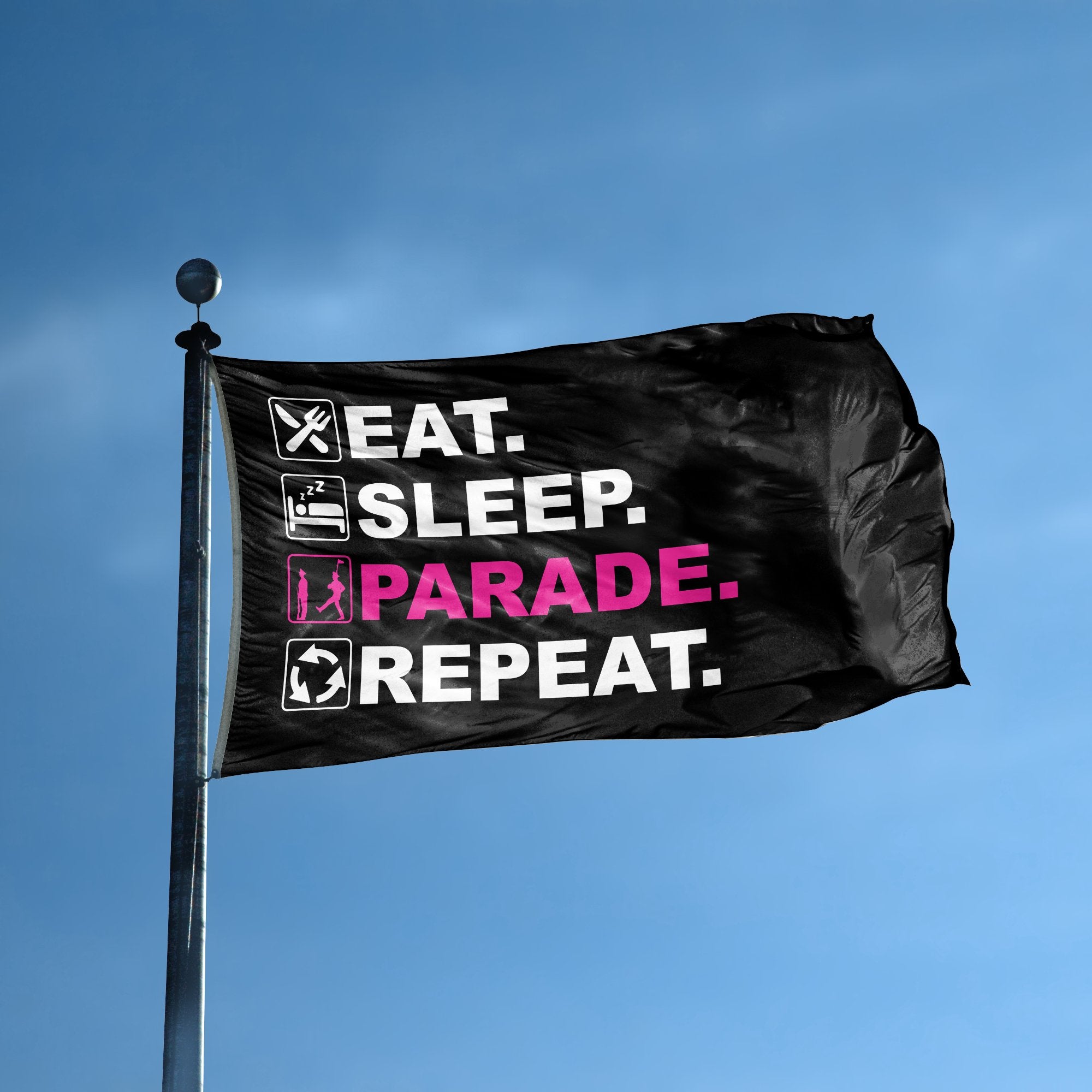 A flag with the saying "Eat Sleep Parade Repeat" displayed on a high pole, with a black, white and themed color scheme.