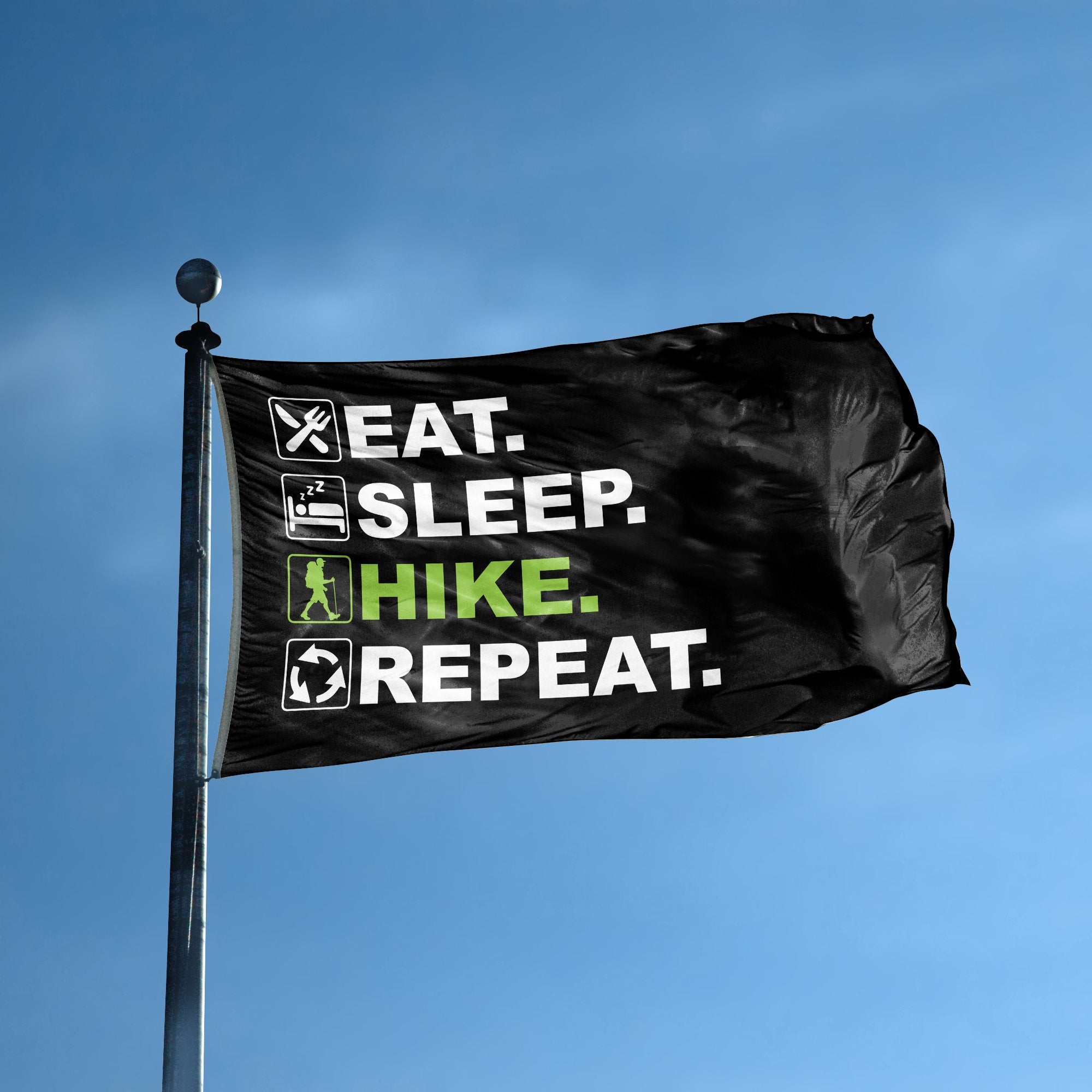 A flag with the saying "Eat Sleep Hike Repeat" displayed on a high pole, with a black, white and themed color scheme.