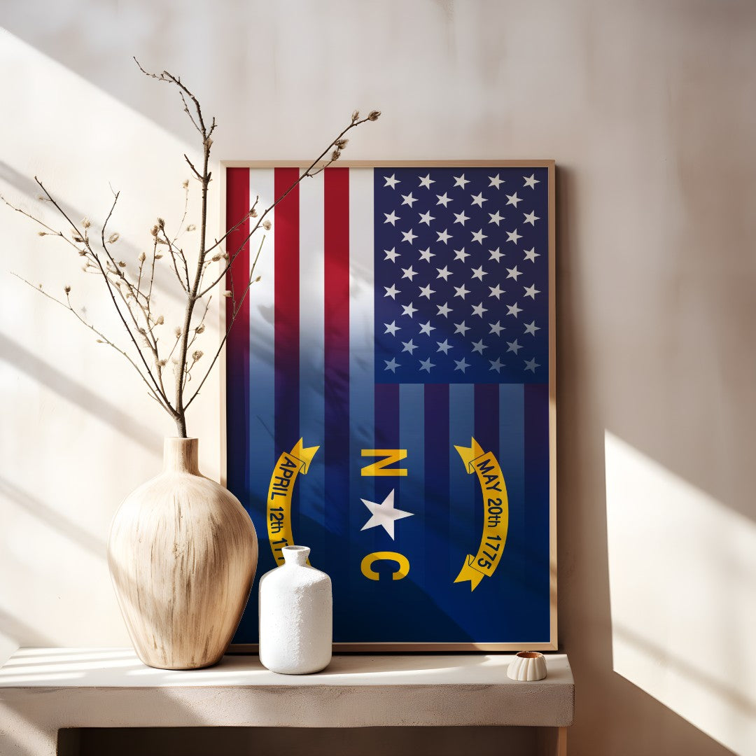Blended US and North Carolina flag print in a wooden frame, showcasing American stars & stripes merged with North Carolina’s emblem, displayed on a tabletop.