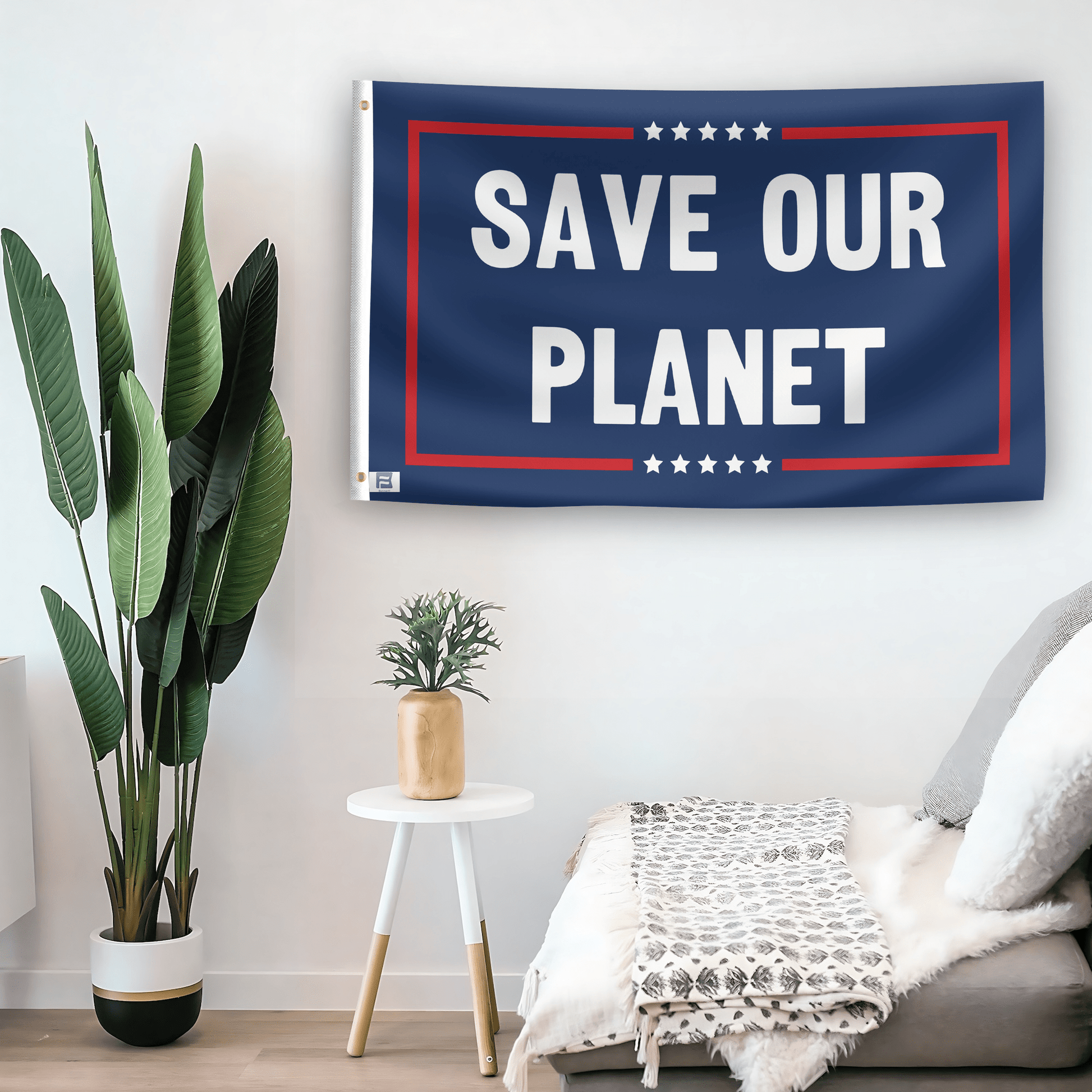 In a home setting, a flag with the saying "Save Our Planet Political" is mounted on a white wall by a side table.