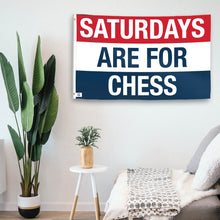 Load image into Gallery viewer, In a home setting, a flag with the saying &quot;https://www.dropbox.com/scl/fi/yij8wjyt13jz4vwda1vze/saturdays-are-for-chess_room.png?rlkey=kdcm0vwhpg6tlrlkivyj7xa9a&amp;raw=1&quot; is mounted on a white wall by a side table.
