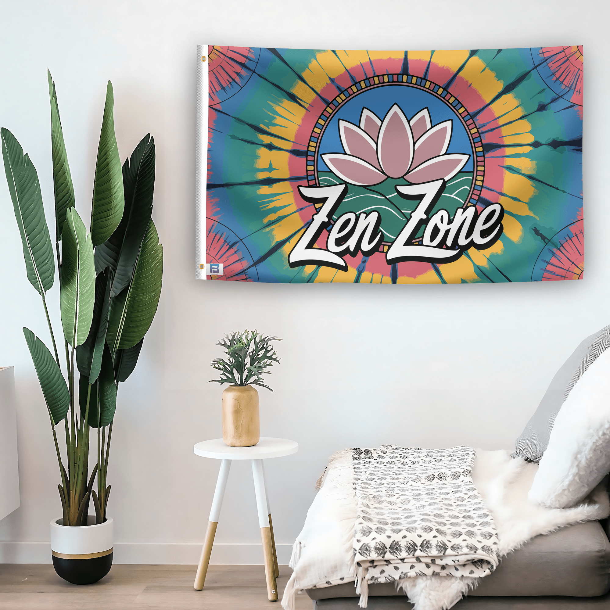 In a home setting, a flag with the saying "Zen Zone" is mounted on a white wall by a side table.