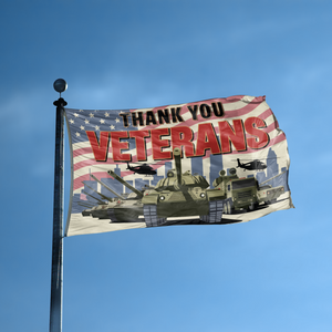 A flag with the saying "Thank You Veterans" displayed on a high pole, with a holiday themed color scheme.