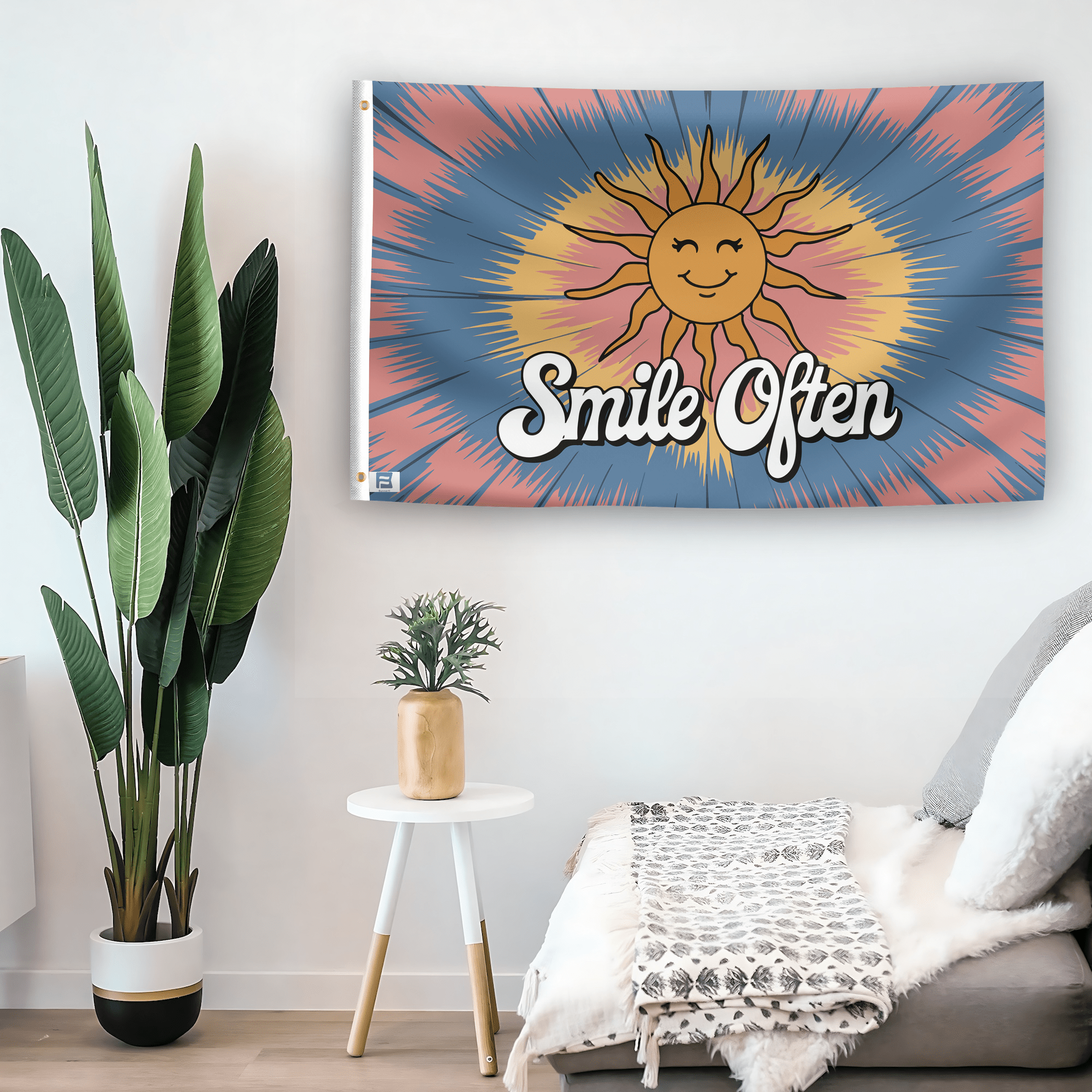 In a home setting, a flag with the saying "Smile Often 70s Style" is mounted on a white wall by a side table.