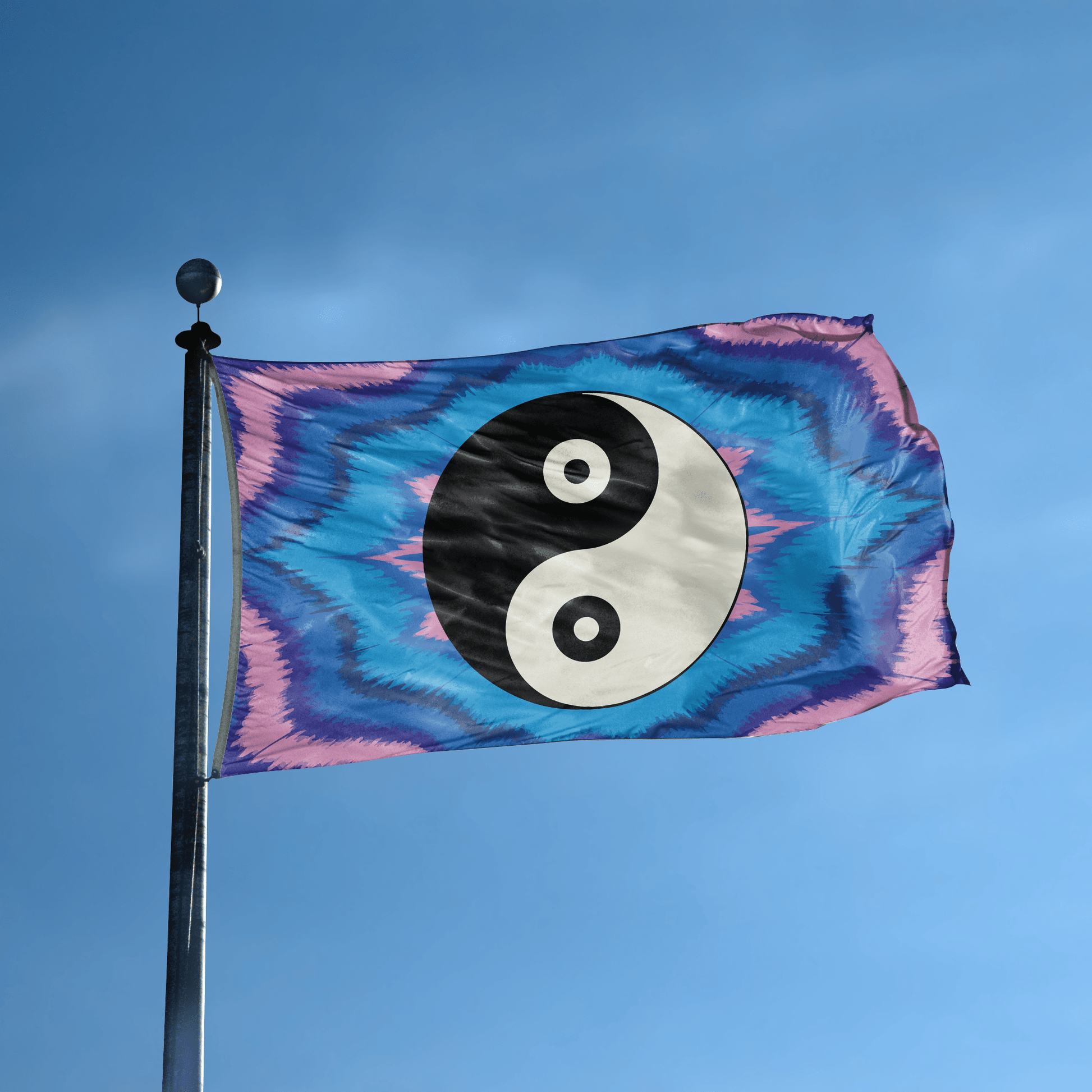 A flag with the saying "Yin and Yang Symbol" displayed on a high pole, with a tie dye style color scheme.