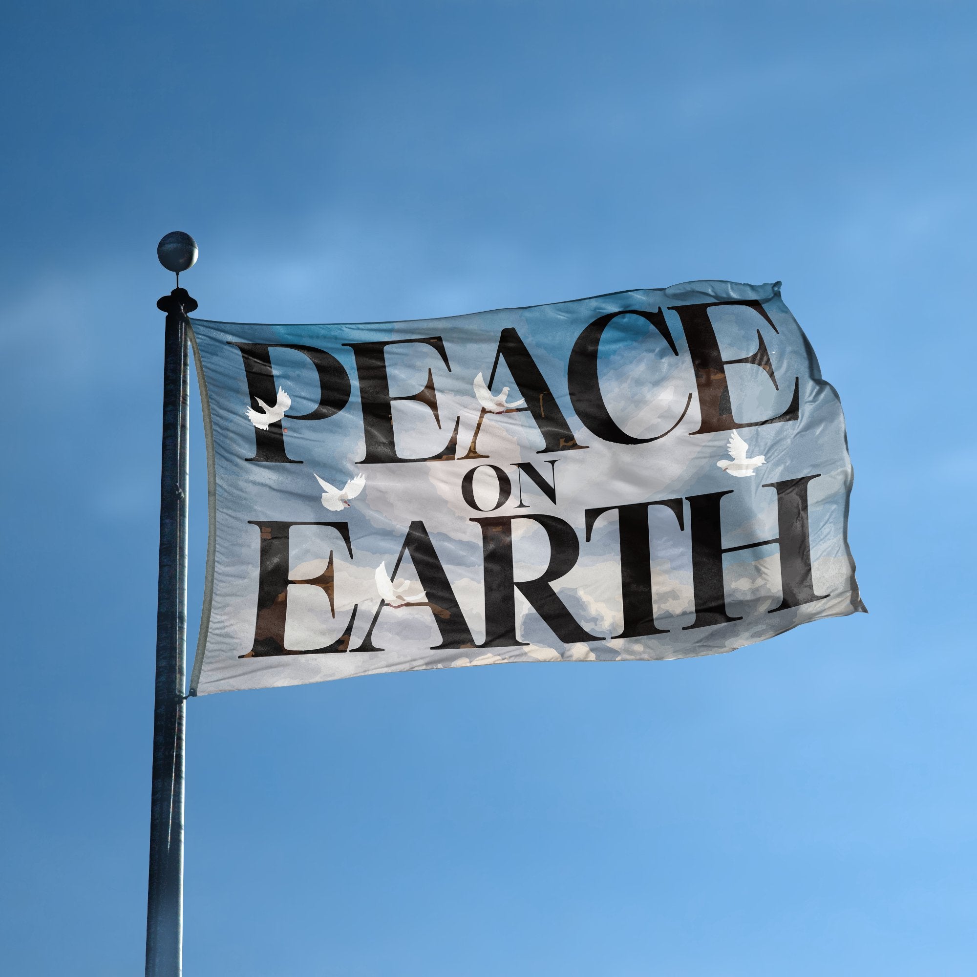 A flag with the saying "Peace On Earth Inspirational" displayed on a high pole, with a special occasion color scheme.