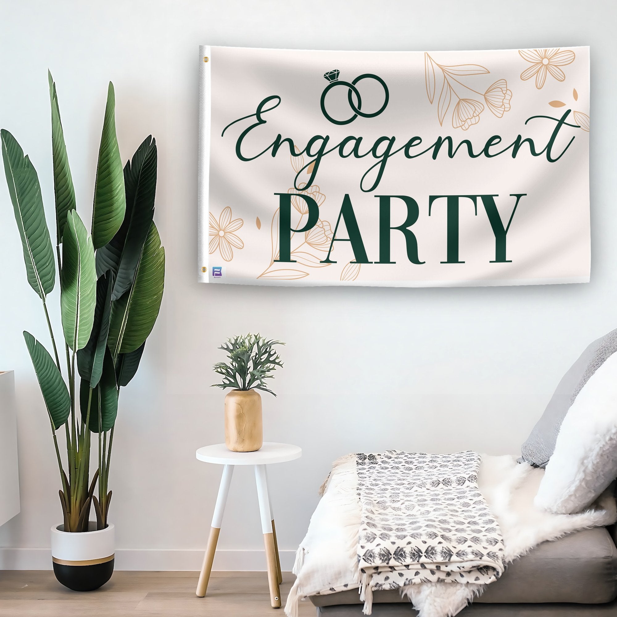 In a home setting, a flag with the saying "Engagement Party" is mounted on a white wall by a side table.