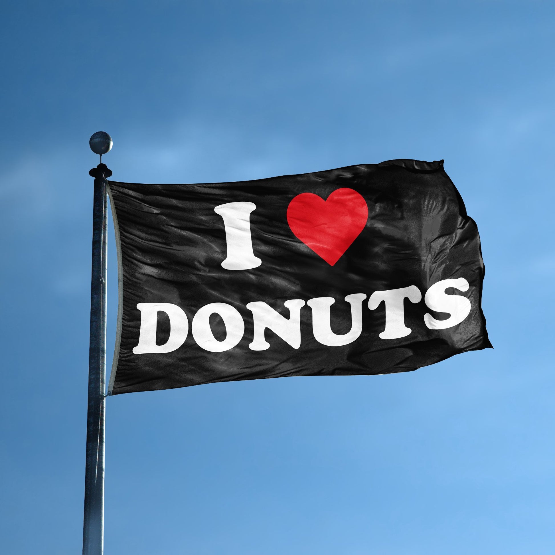 A flag with the saying "I Love Donuts" displayed on a high pole, with a black, white and red color scheme.