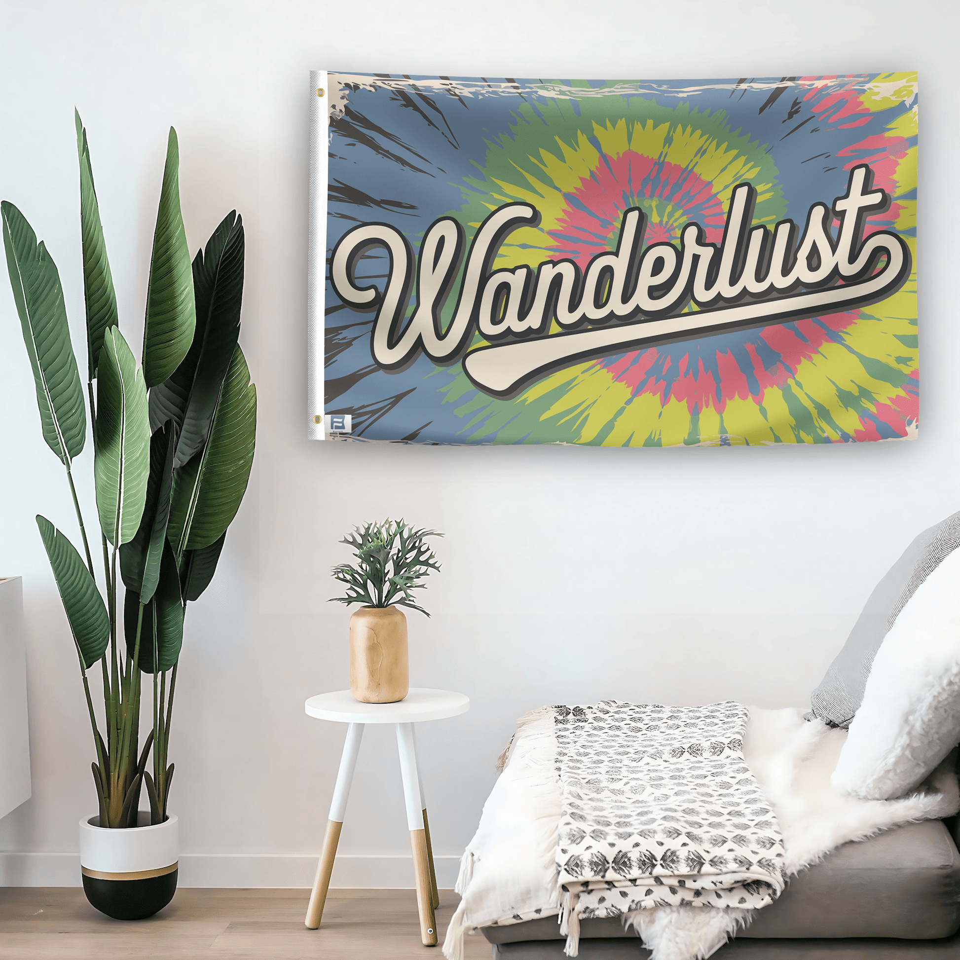 In a home setting, a flag with the saying "Wanderlust" is mounted on a white wall by a side table.