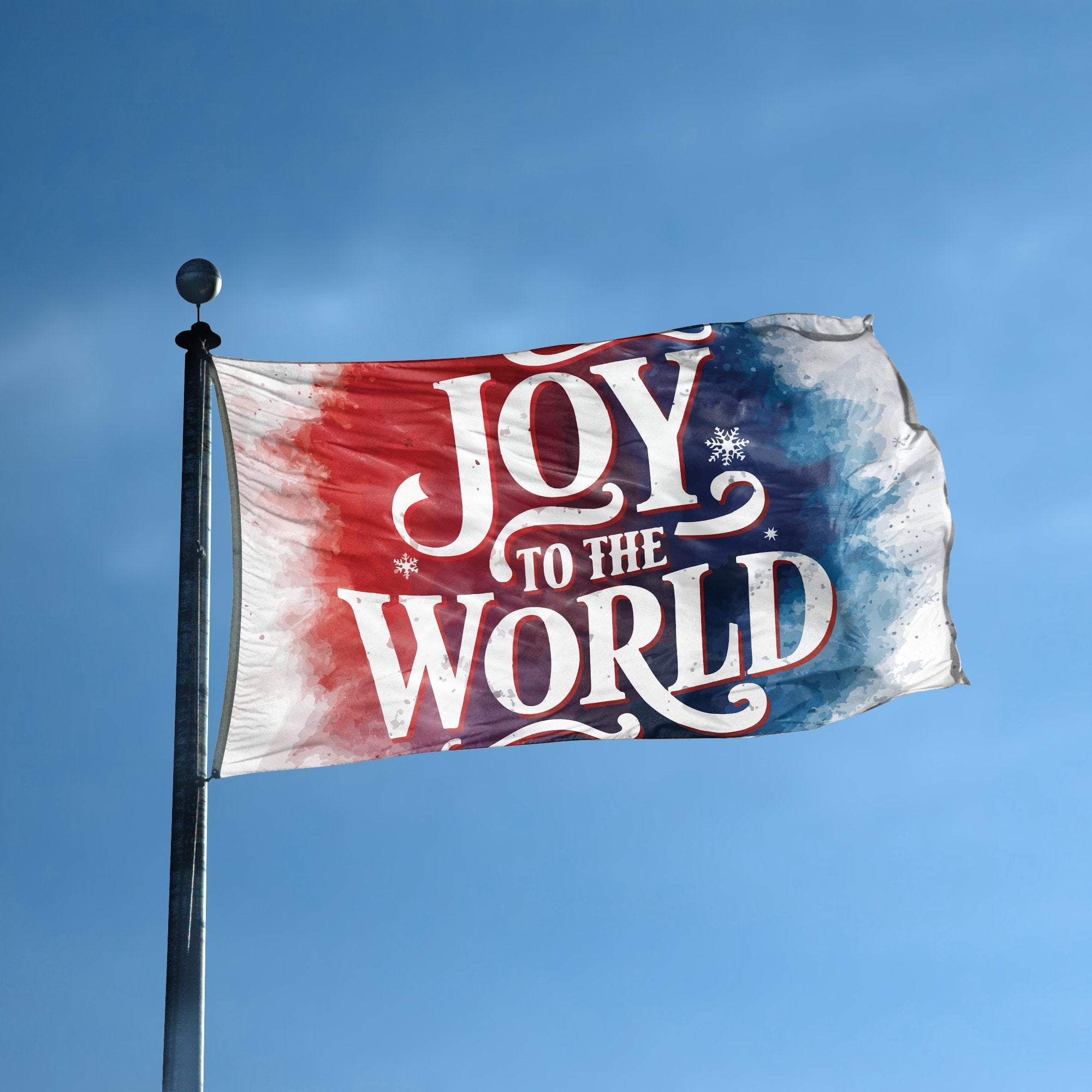 A flag with the saying "Joy To The World" displayed on a high pole, with a special occasion color scheme.