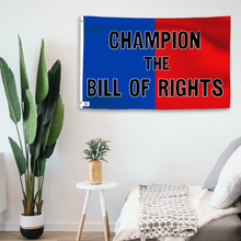 Load image into Gallery viewer, In a home setting, a blue and red flag with a political slogan is mounted on a white wall by a side table.
