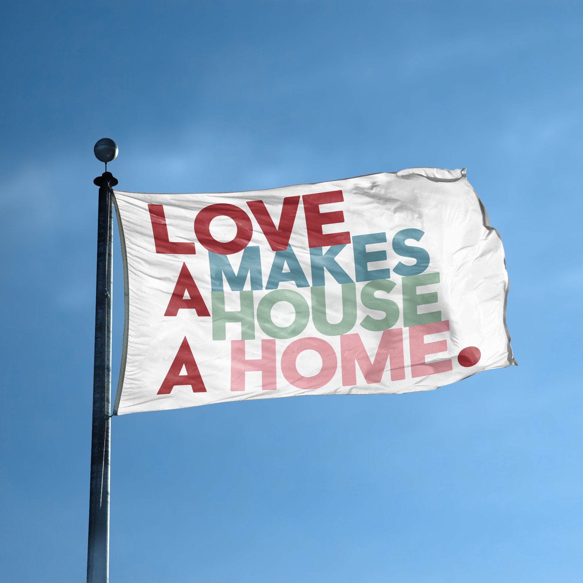 A flag with the saying "Love Makes A House A Home" displayed on a high pole, with a special occasion color scheme.