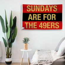 Load image into Gallery viewer, In a home setting, a flag with the saying &quot;https://www.dropbox.com/scl/fi/4mluwgdybn8ygy6q5y179/sundays-are-for-the-49ers_room.png?rlkey=werhdcirpdg3urf6alsloi52b&amp;raw=1&quot; is mounted on a white wall by a side table.
