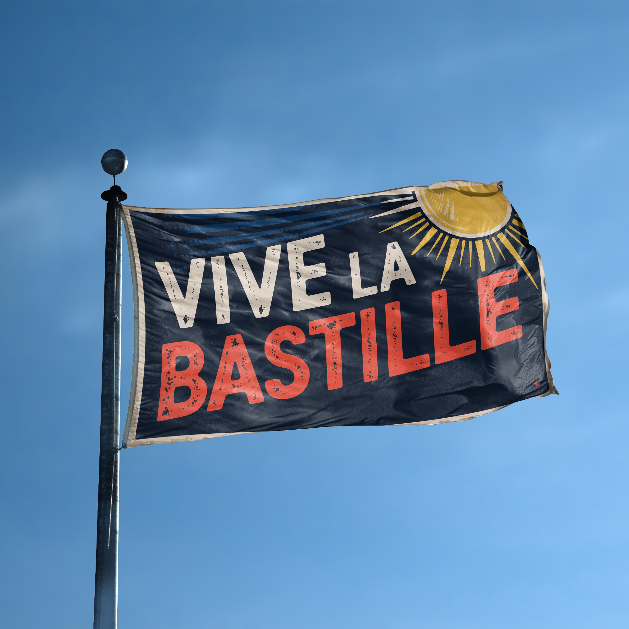 A flag with the saying "Vive La Bastille" displayed on a high pole, with a holiday themed color scheme.