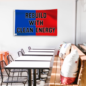 A political flag in royal blue and crimson red with a political statement on a wall in a cafe setting.