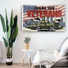 Load image into Gallery viewer, In a home setting, a flag with the saying &quot;Thank You Veterans&quot; is mounted on a white wall by a side table.
