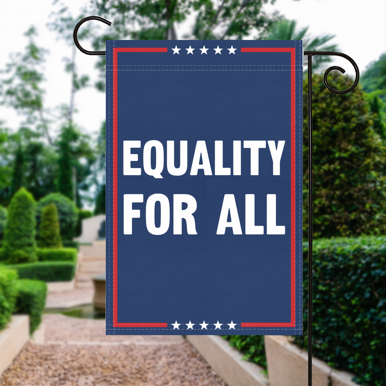 A red, white and blue political garden flag with the slogan Equality For All.