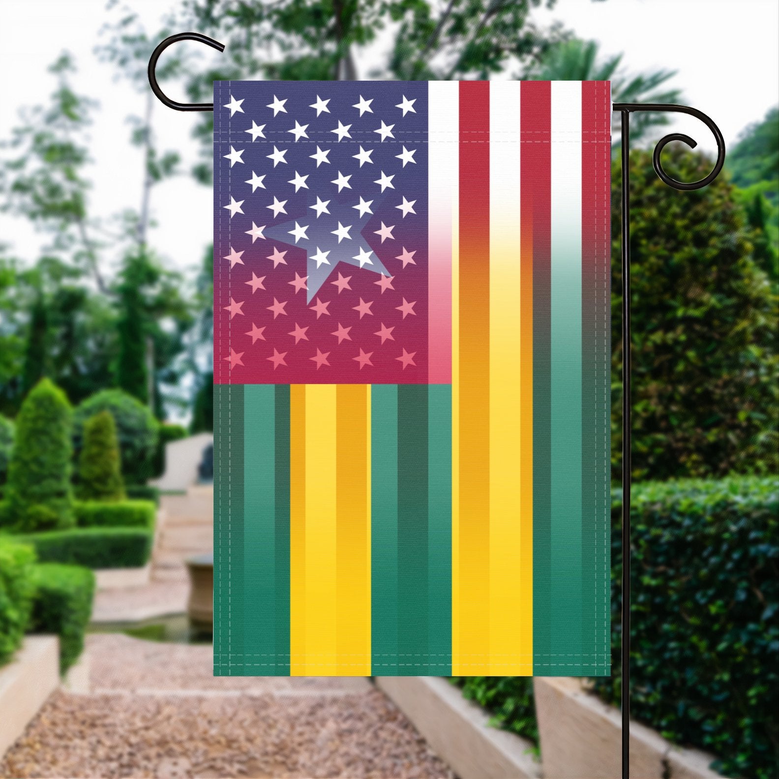 A garden flag with the Togolese American flag design seamlessly blended with the American flag, displayed in a garden.