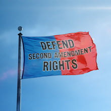 Load image into Gallery viewer, A flag containing a political slogan displayed on a high pole, featuring a patriotic red and blue background.
