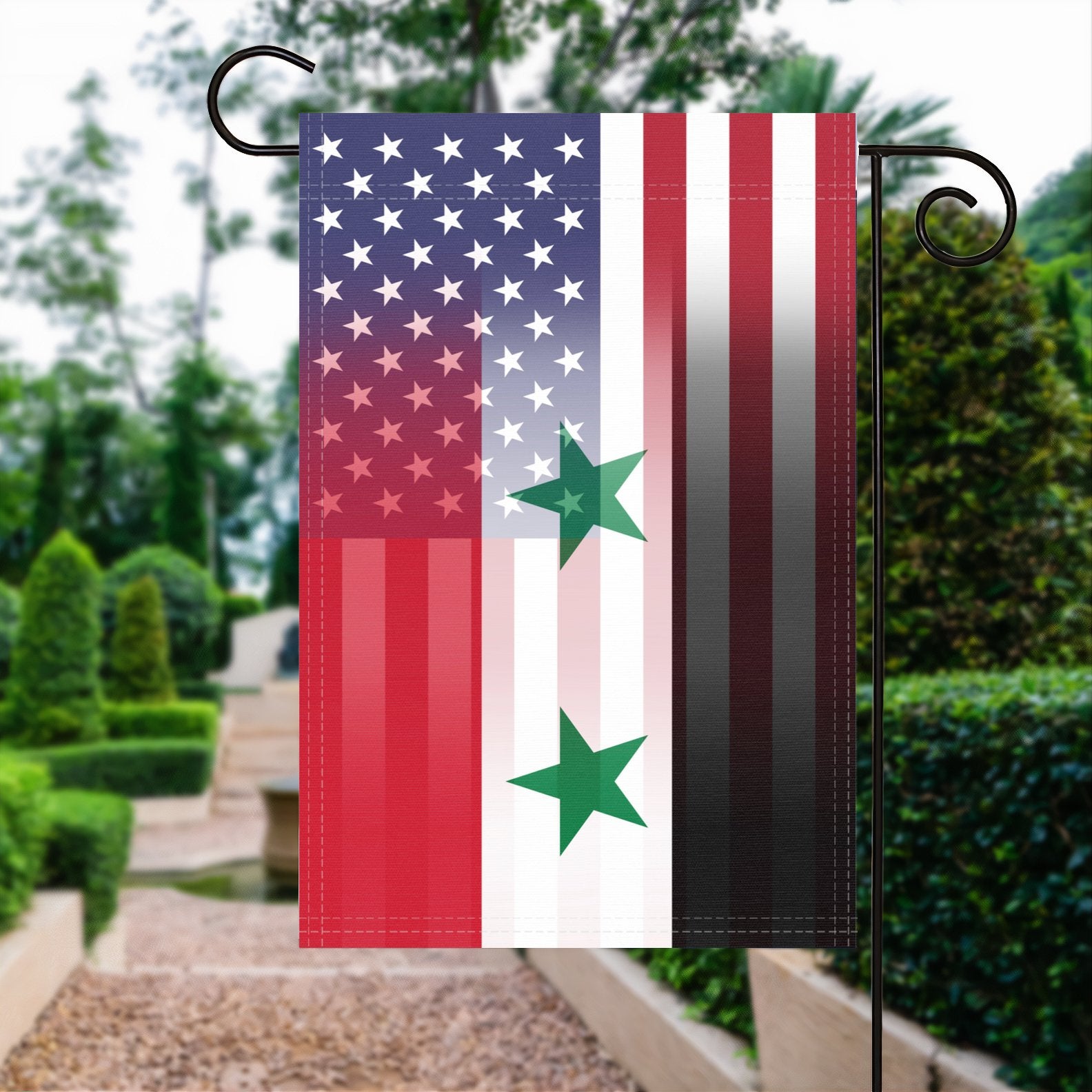 A garden flag with the Syrian American flag design seamlessly blended with the American flag, displayed in a garden.