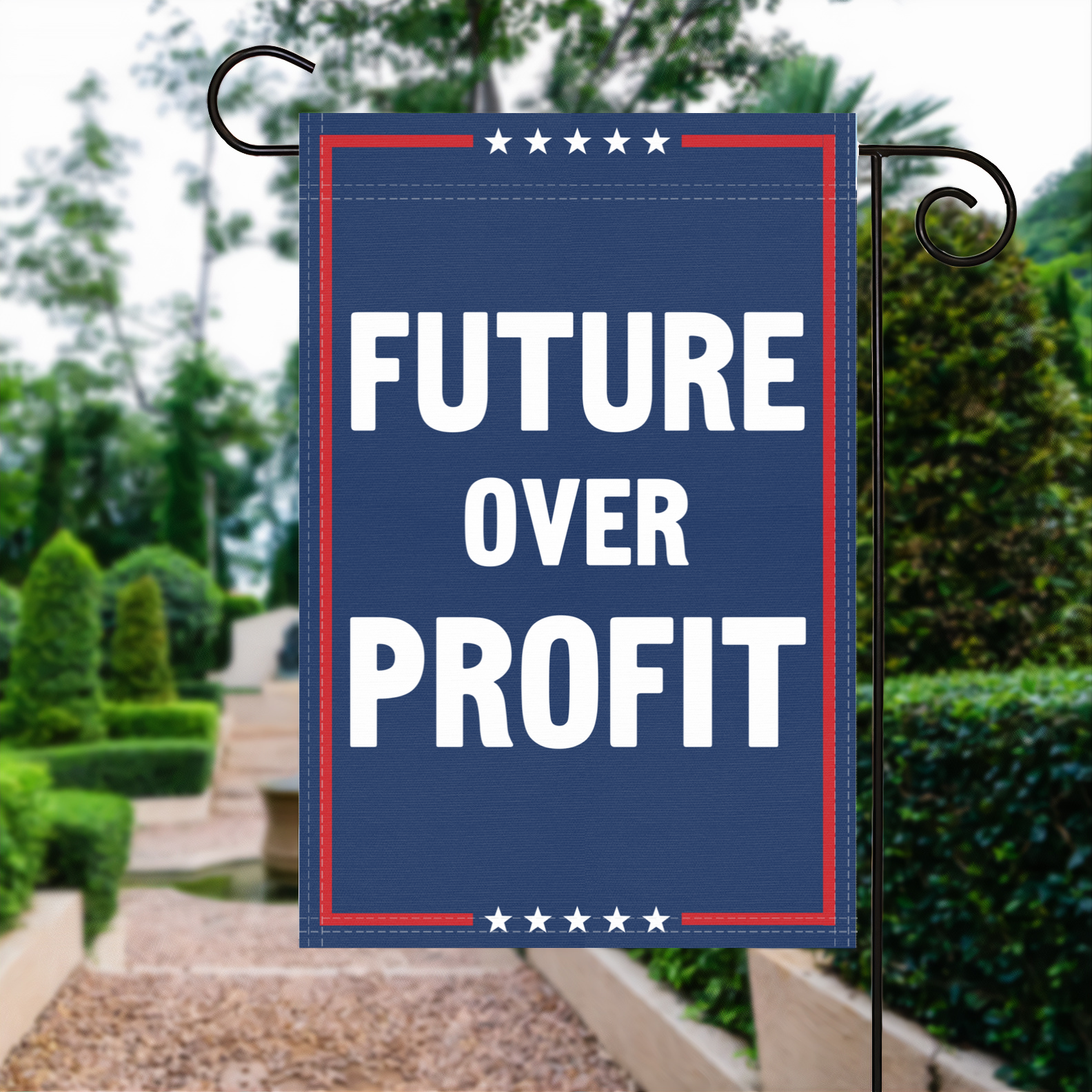 A red, white and blue political garden flag with the slogan Future Over Profit.