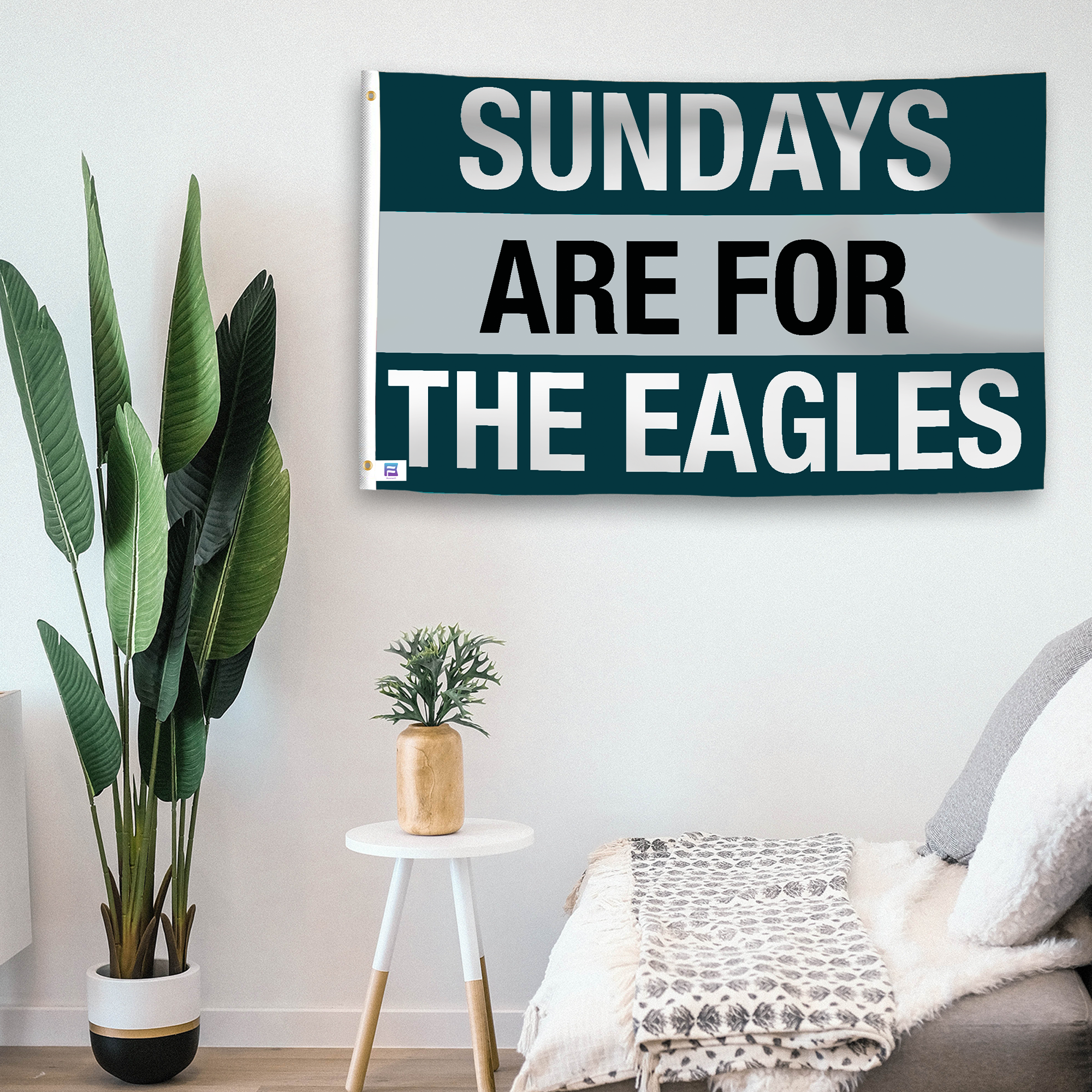 In a home setting, a flag with the saying "https://www.dropbox.com/scl/fi/rwxk7zij44ngnbyvahzui/sundays-are-for-the-eagles_room.png?rlkey=9twj8sdka4xvnae339gk565rx&raw=1" is mounted on a white wall by a side table.