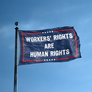 A flag with the saying "Workers’ Rights Are Human Rights Political" displayed on a high pole, with a red, white, and blue color scheme.