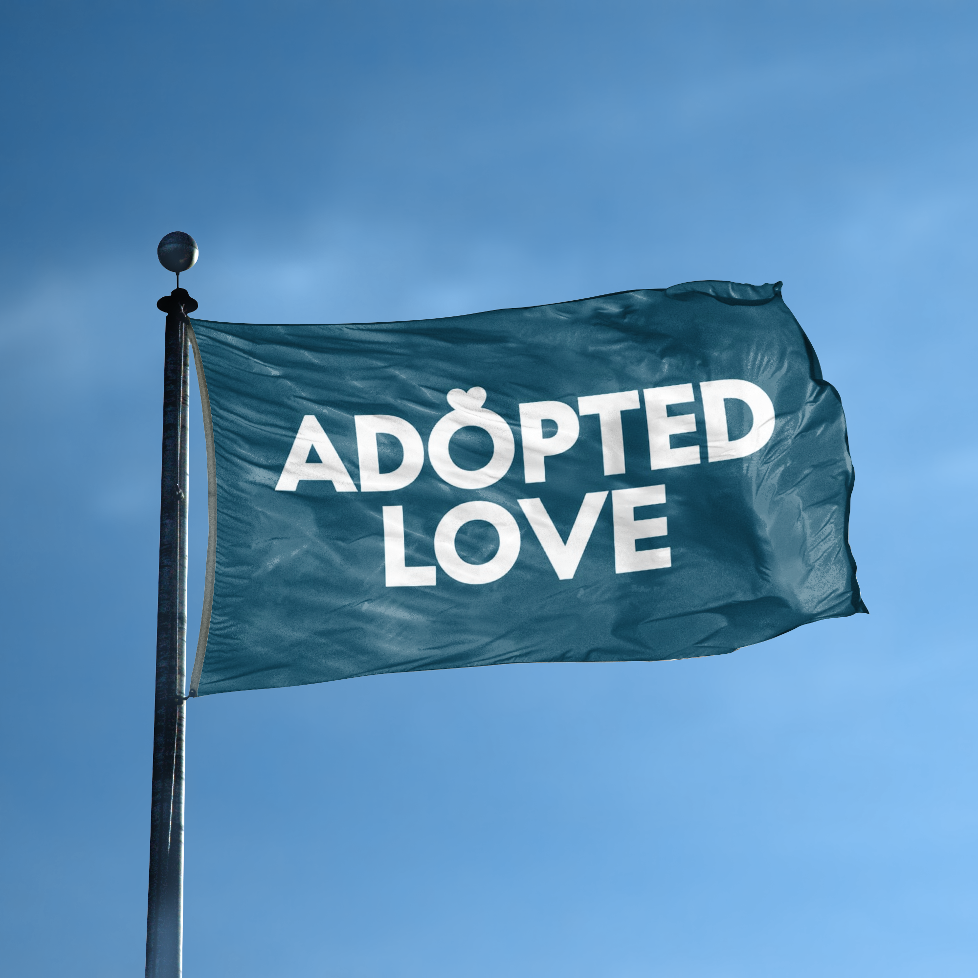 A flag with the saying "Adopted Love Pet" displayed on a high pole, with a special occasion color scheme.