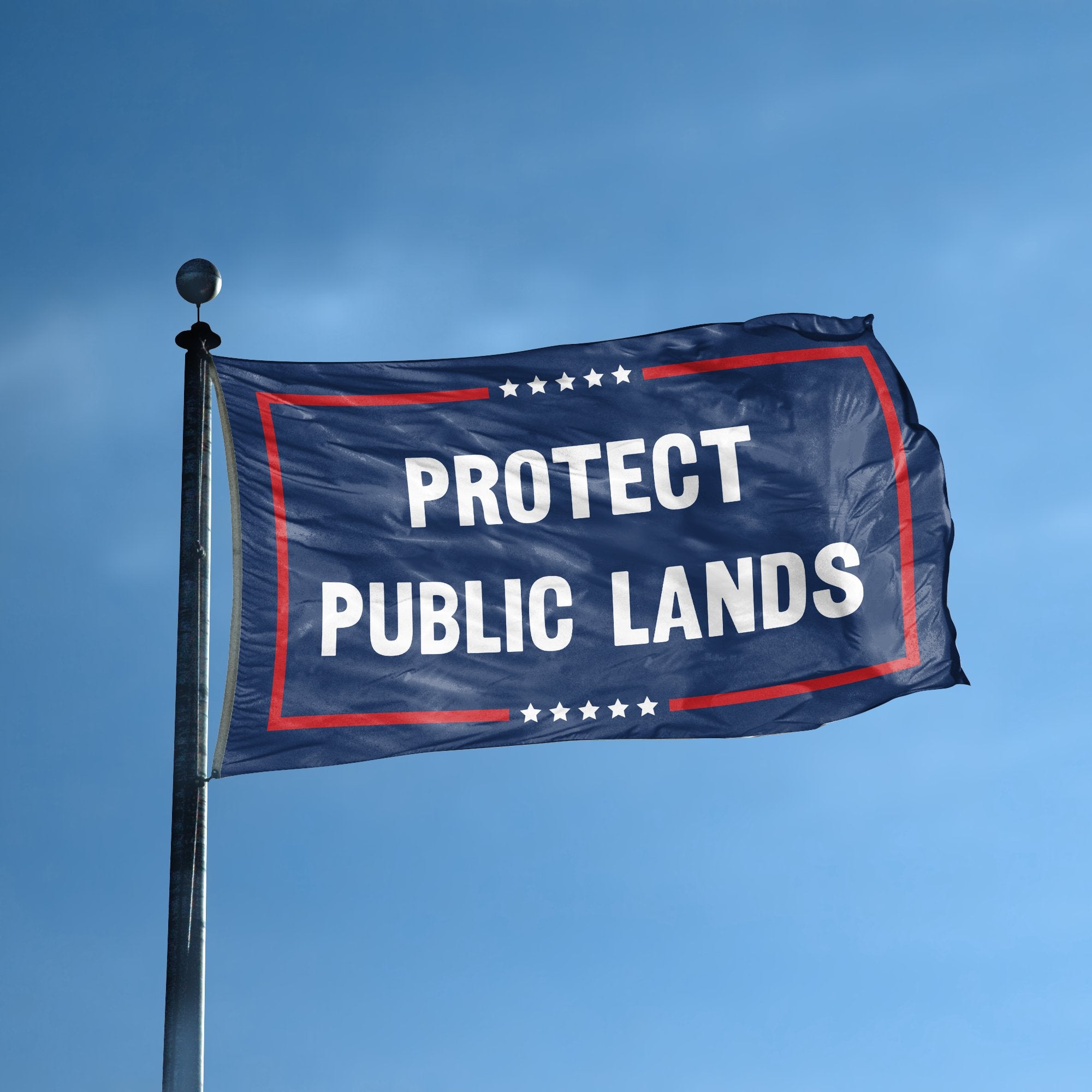 A flag with the saying "Protect Public Lands Political" displayed on a high pole, with a red, white, and blue color scheme.