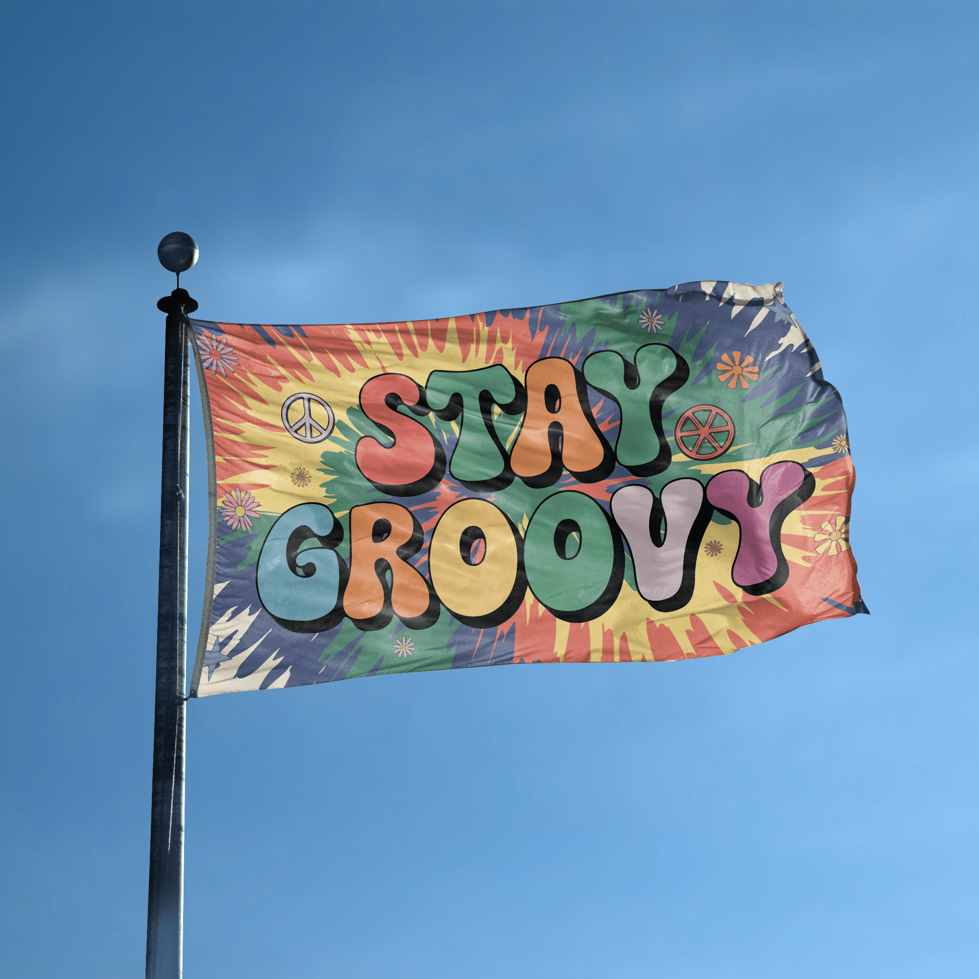 A flag with the saying "Stay Groovy" displayed on a high pole, with a tie dye style color scheme.