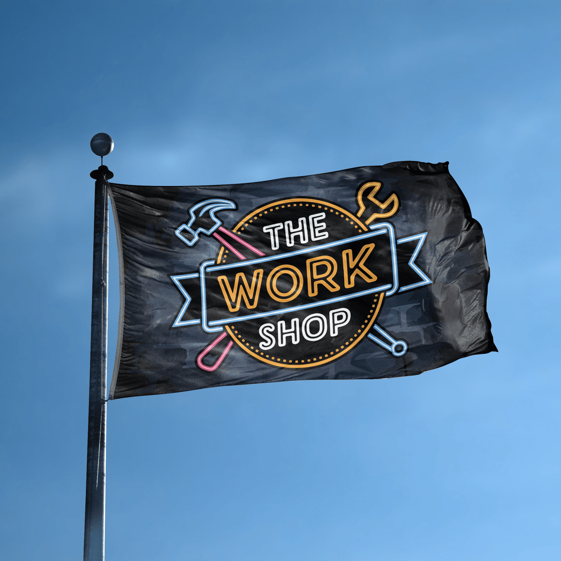 A flag with the saying "The Work Shop" displayed on a high pole, with a neon style color scheme.