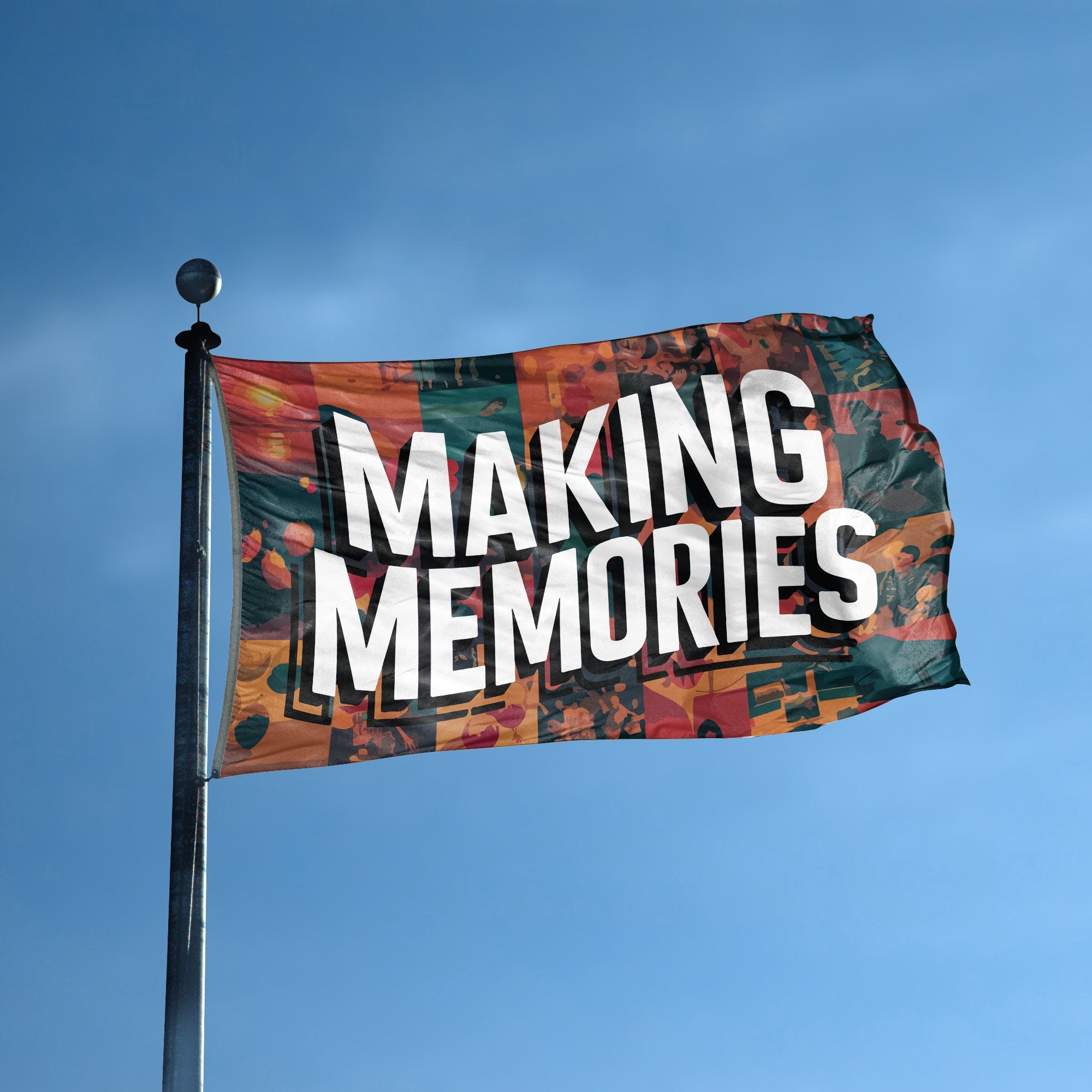 A flag with the saying "Making Memories" displayed on a high pole, with a special occasion color scheme.