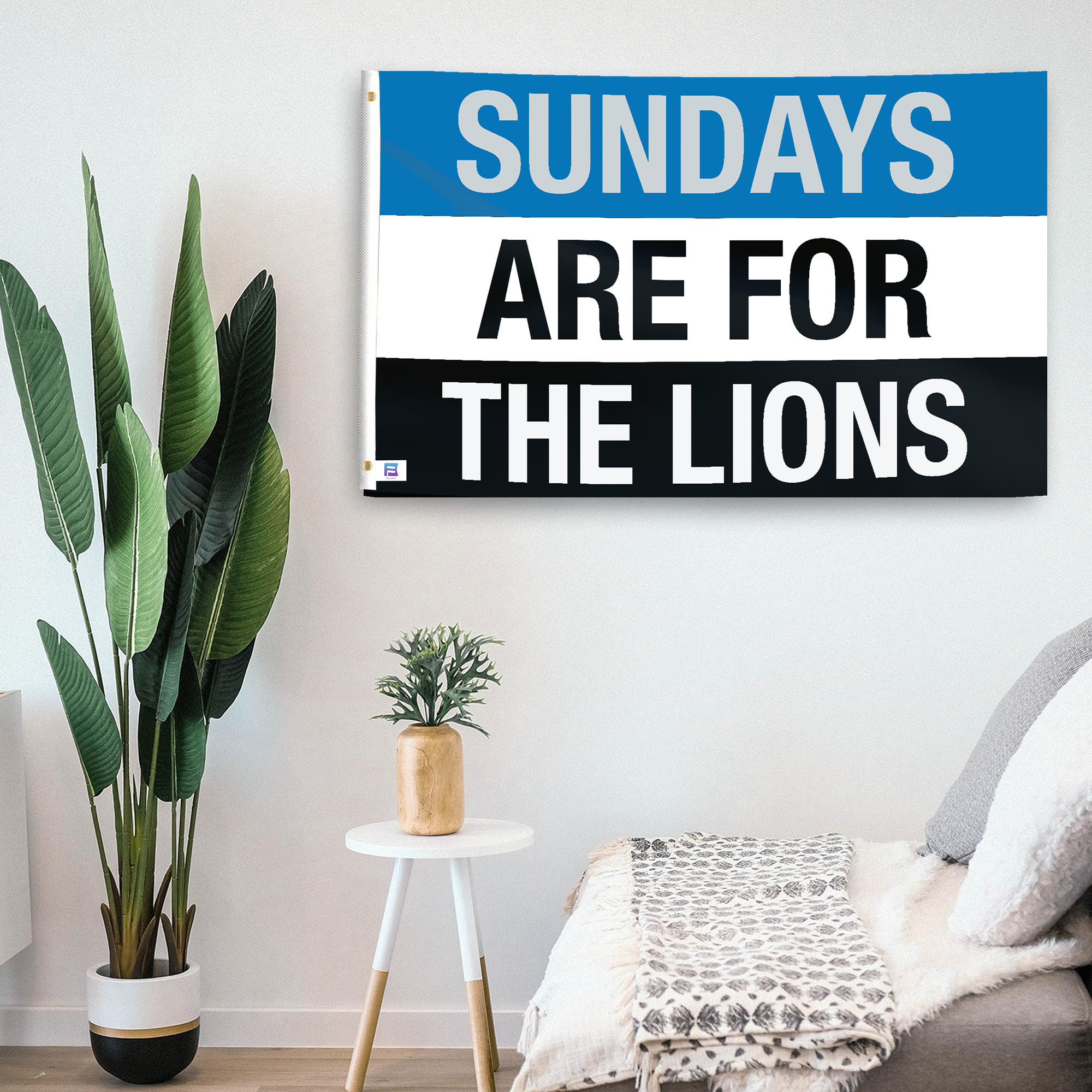 In a home setting, a flag with the saying "https://www.dropbox.com/scl/fi/yap68b8d4n11gfaktqipm/sundays-are-for-the-lions_room.png?rlkey=vxcbqr5b7u3tu06u6gdwl0jvj&raw=1" is mounted on a white wall by a side table.