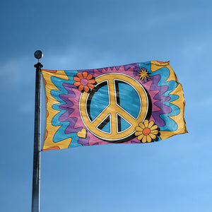 A flag with the saying "Peace Sign" displayed on a high pole, with a tie dye style color scheme.