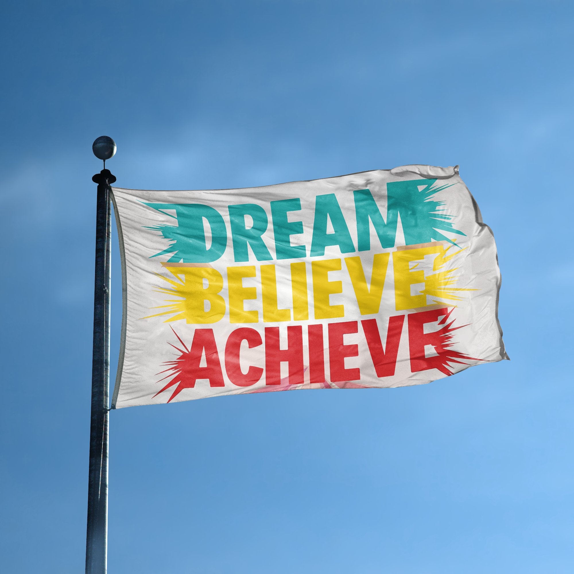 A flag with the saying "Dream Believe Achieve" displayed on a high pole, with a special occasion color scheme.