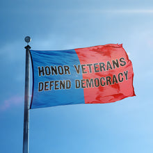 Load image into Gallery viewer, A flag containing a political slogan displayed on a high pole, featuring a patriotic red and blue background.
