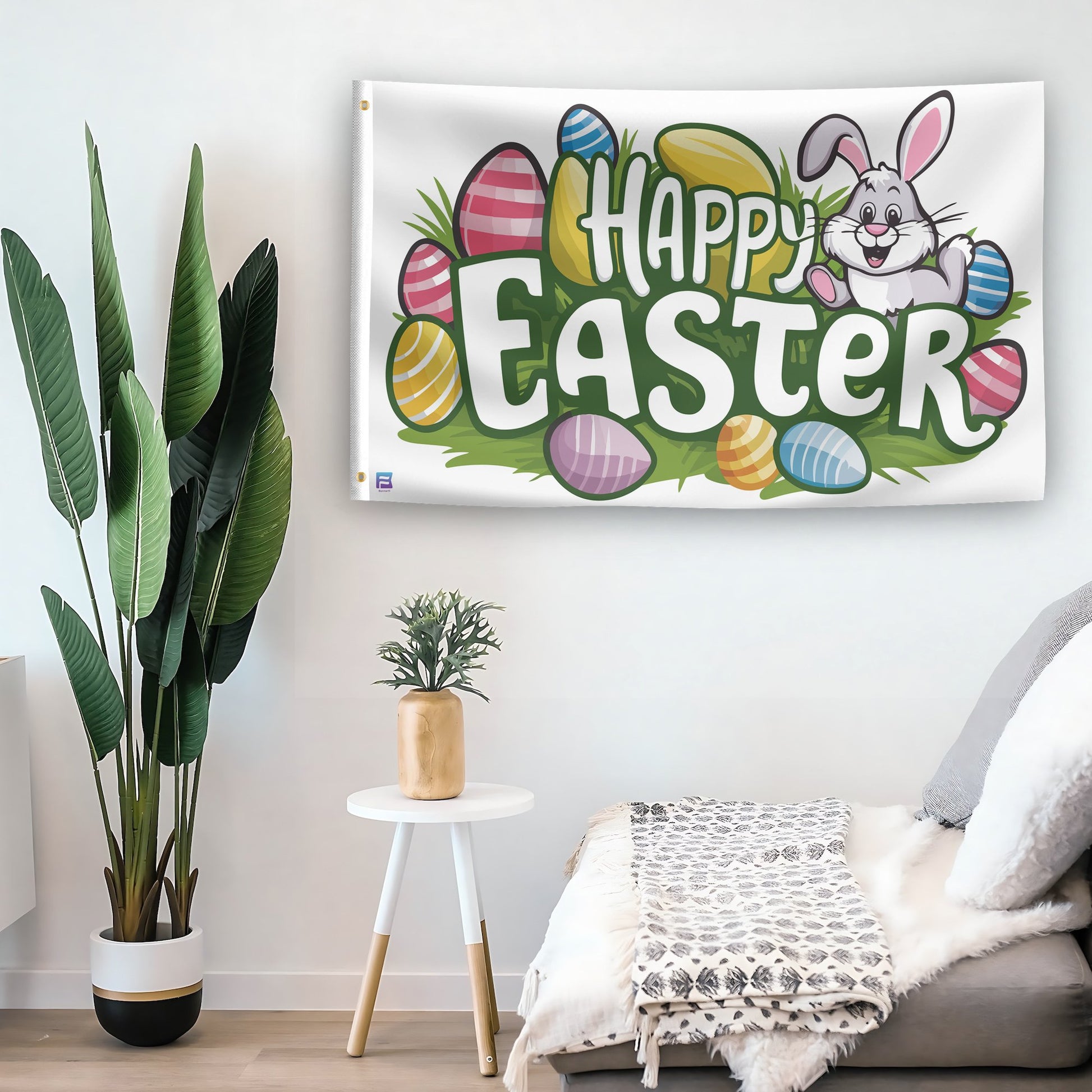 In a home setting, a flag with the saying "Happy Easter" is mounted on a white wall by a side table.