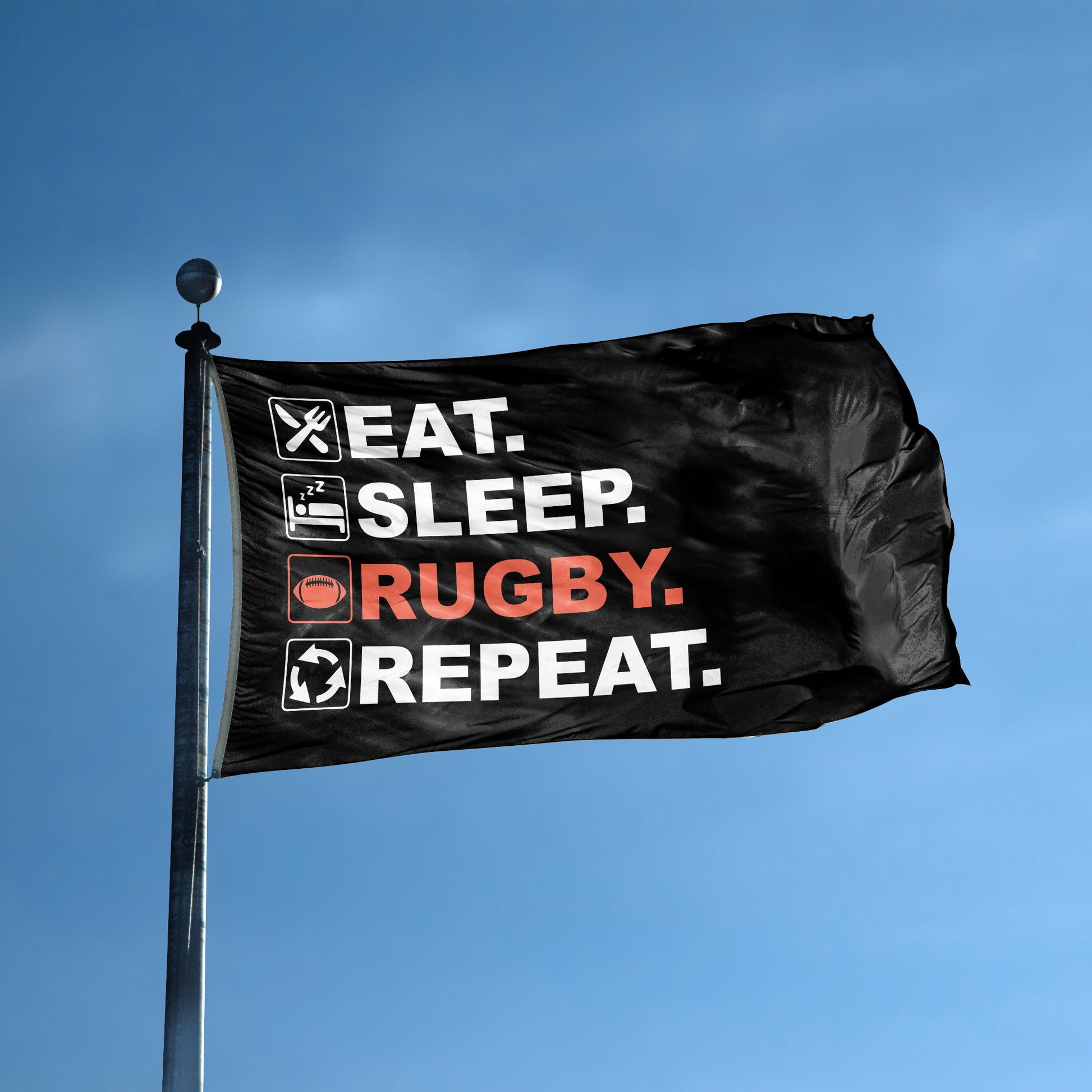 A flag with the saying "Eat Sleep Rugby Repeat" displayed on a high pole, with a black, white and themed color scheme.