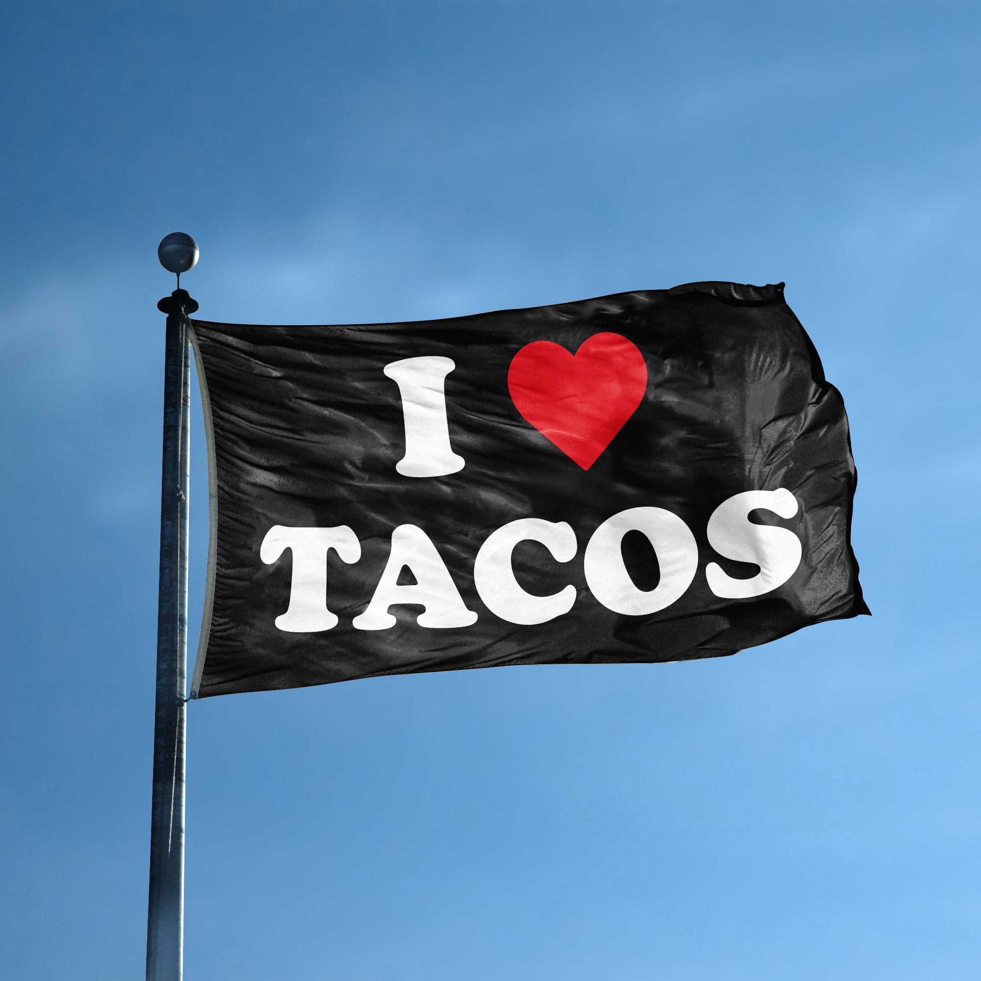 A flag with the saying "I Love Tacos" displayed on a high pole, with a black, white and red color scheme.