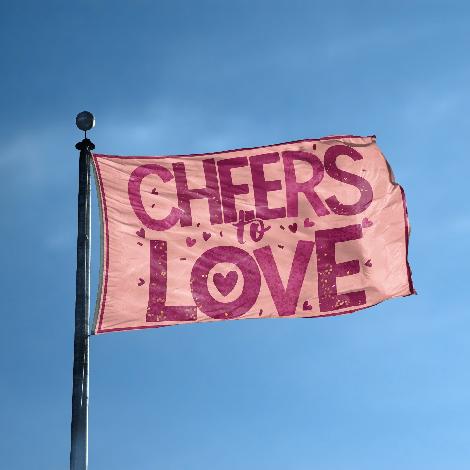 A flag with the saying "Cheers To Love" displayed on a high pole, with a special occasion color scheme.