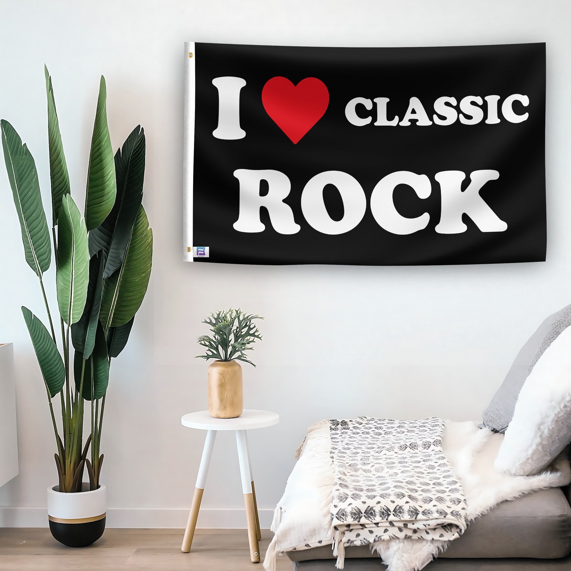 In a home setting, a flag with the saying "I Love Classic Rock" is mounted on a white wall by a side table.