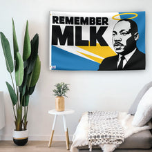 Load image into Gallery viewer, In a home setting, a flag with the saying &quot;Remember MLK&quot; is mounted on a white wall by a side table.
