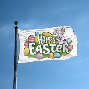 A flag with the saying "Happy Easter" displayed on a high pole, with a holiday themed color scheme.