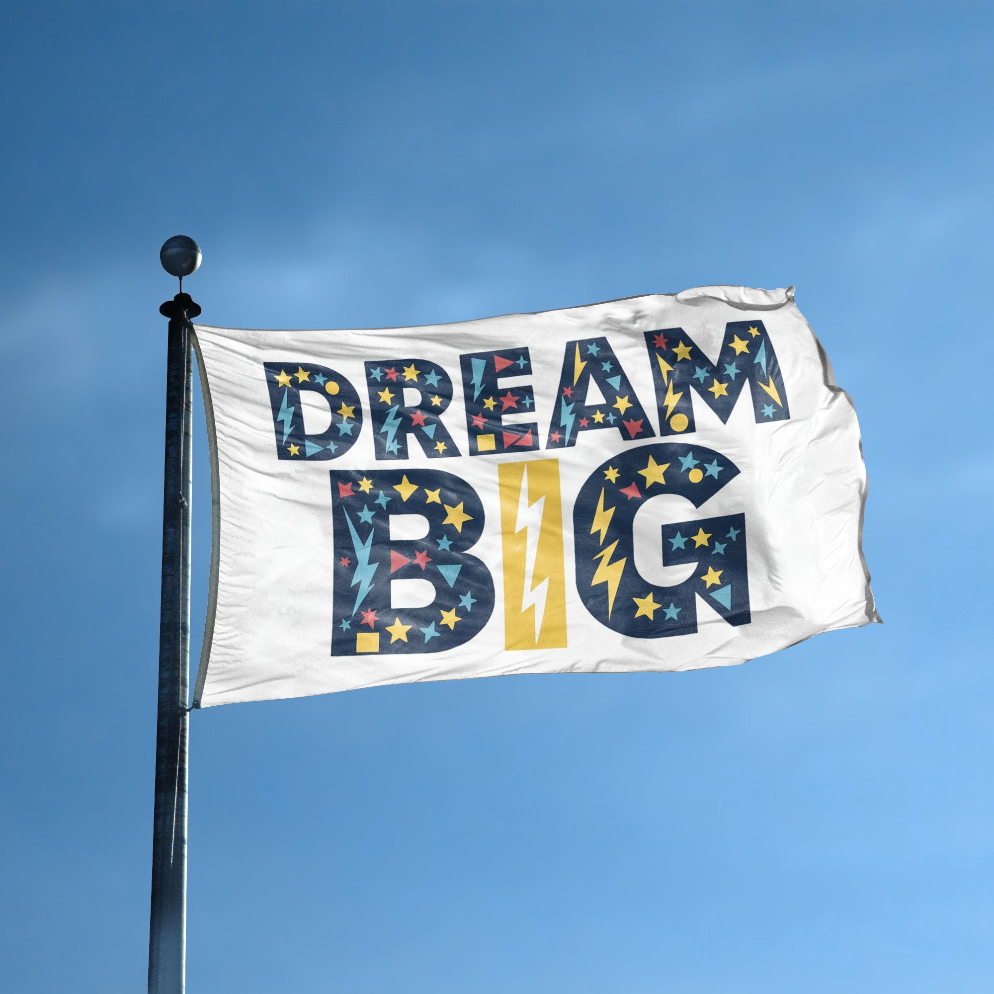 A flag with the saying "Dream Big Motivational" displayed on a high pole, with a special occasion color scheme.