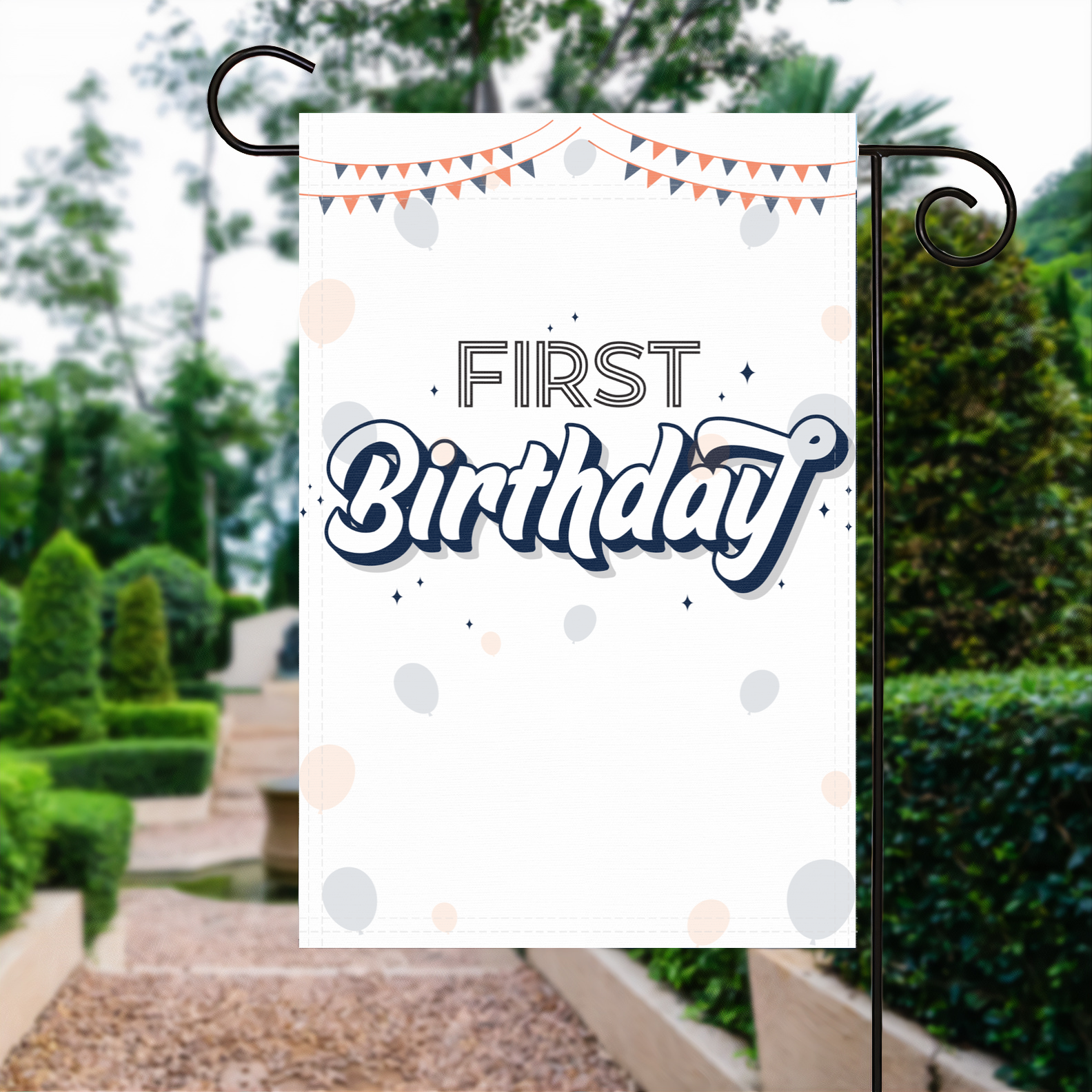 First Birthday garden flag made of weatherproof polyester displayed in a garden | Bannerfi