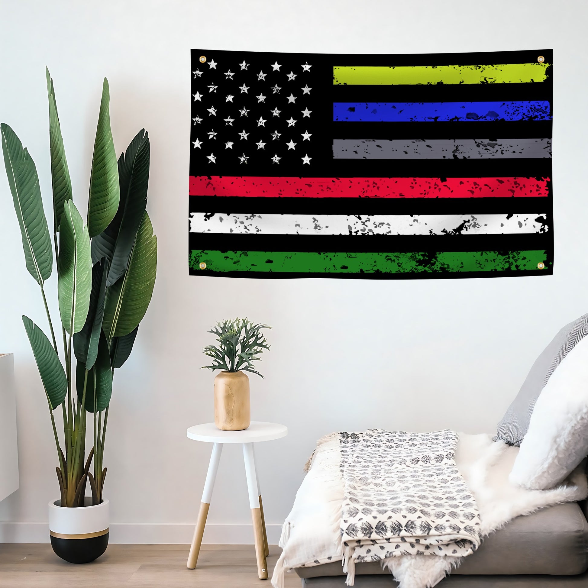 American flag banner with first responders thin stripes on a wall above a couch.