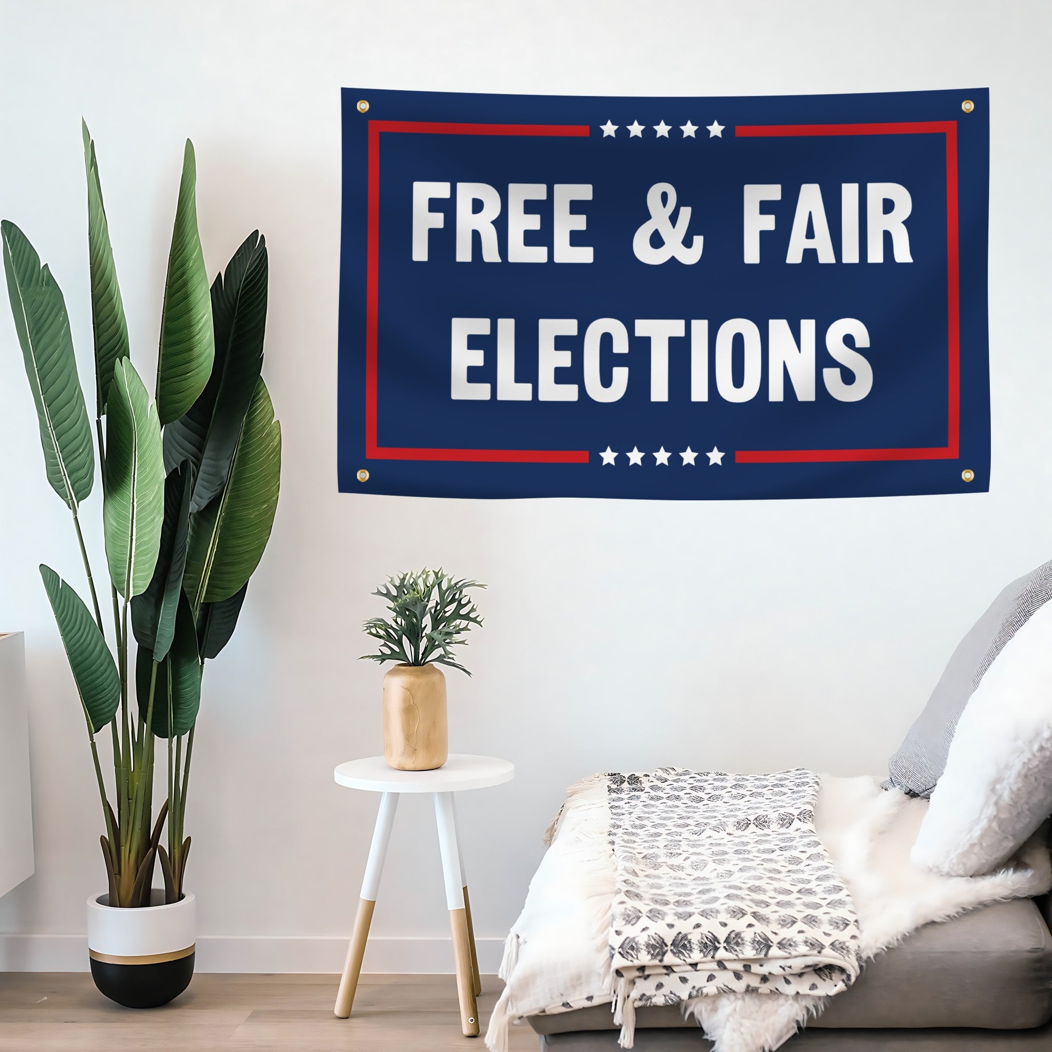 A political flag banner with the saying "Free And Fair Elections Political", with a red, white, and blue color scheme mounted on a wall. 