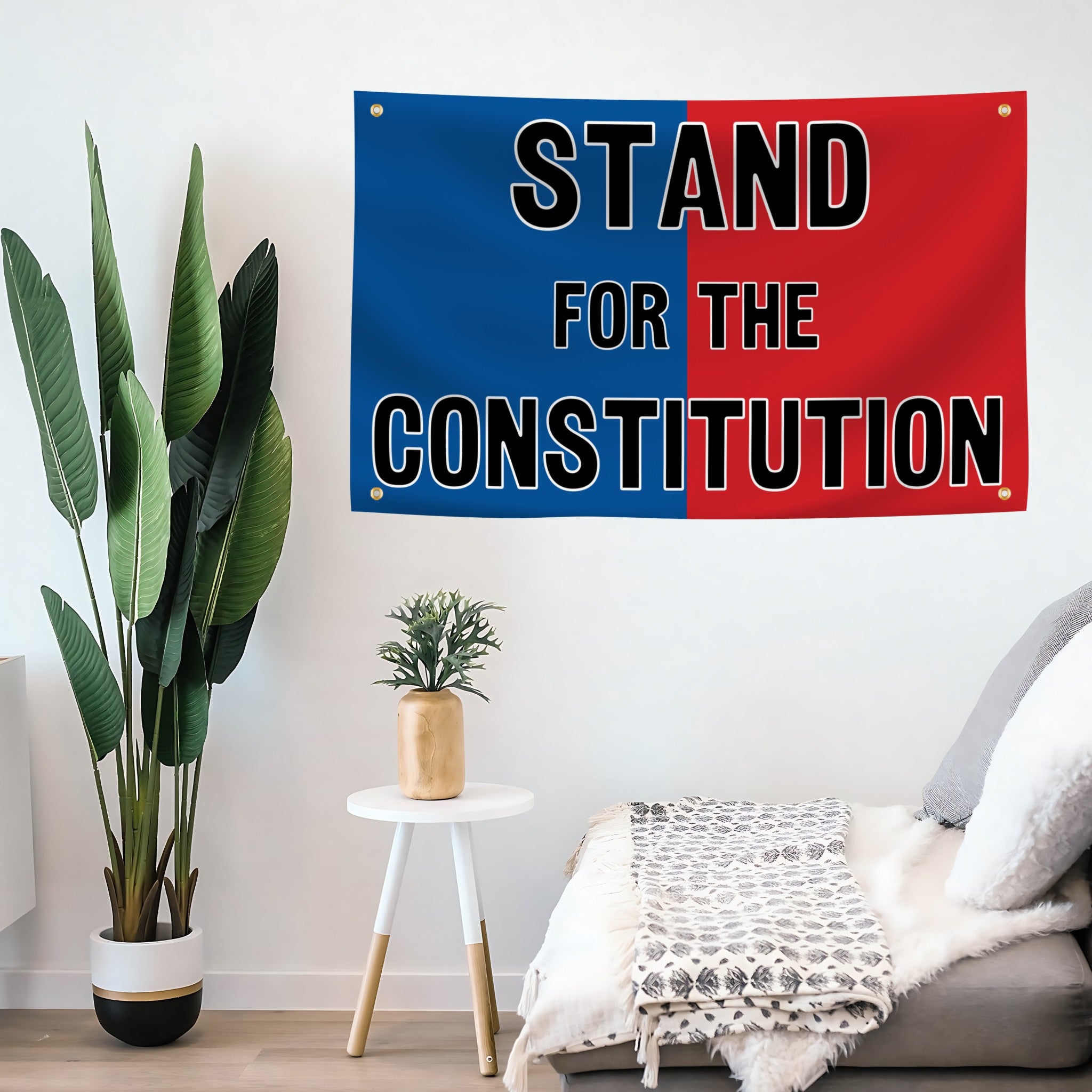 Room interior with a 'Stand for the Constitution' flag banner on the wall.