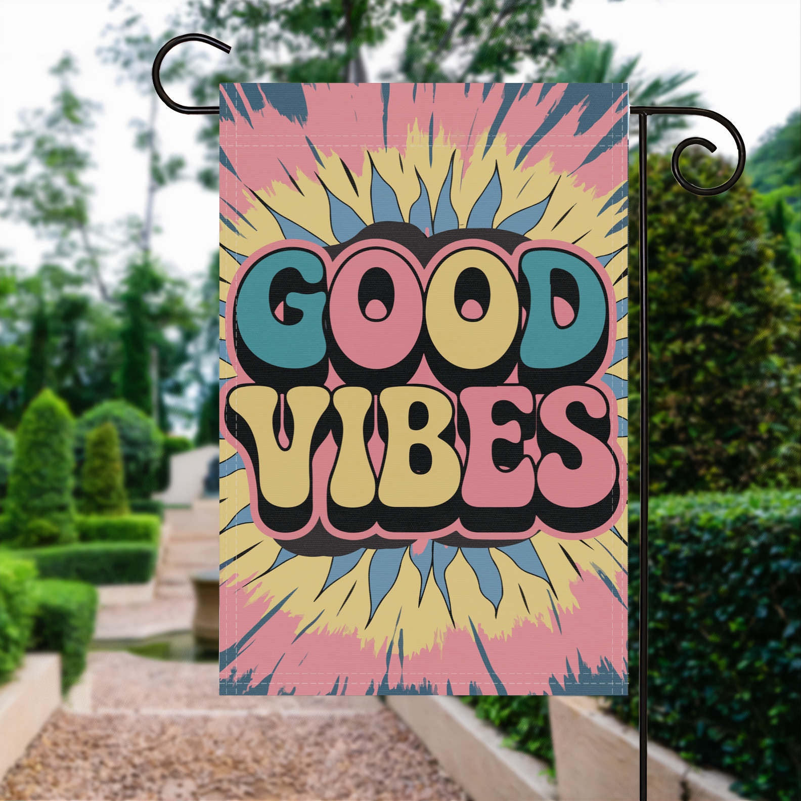 Good Vibes Tie-Dye garden flag made of weatherproof polyester displayed in a garden | Bannerfi