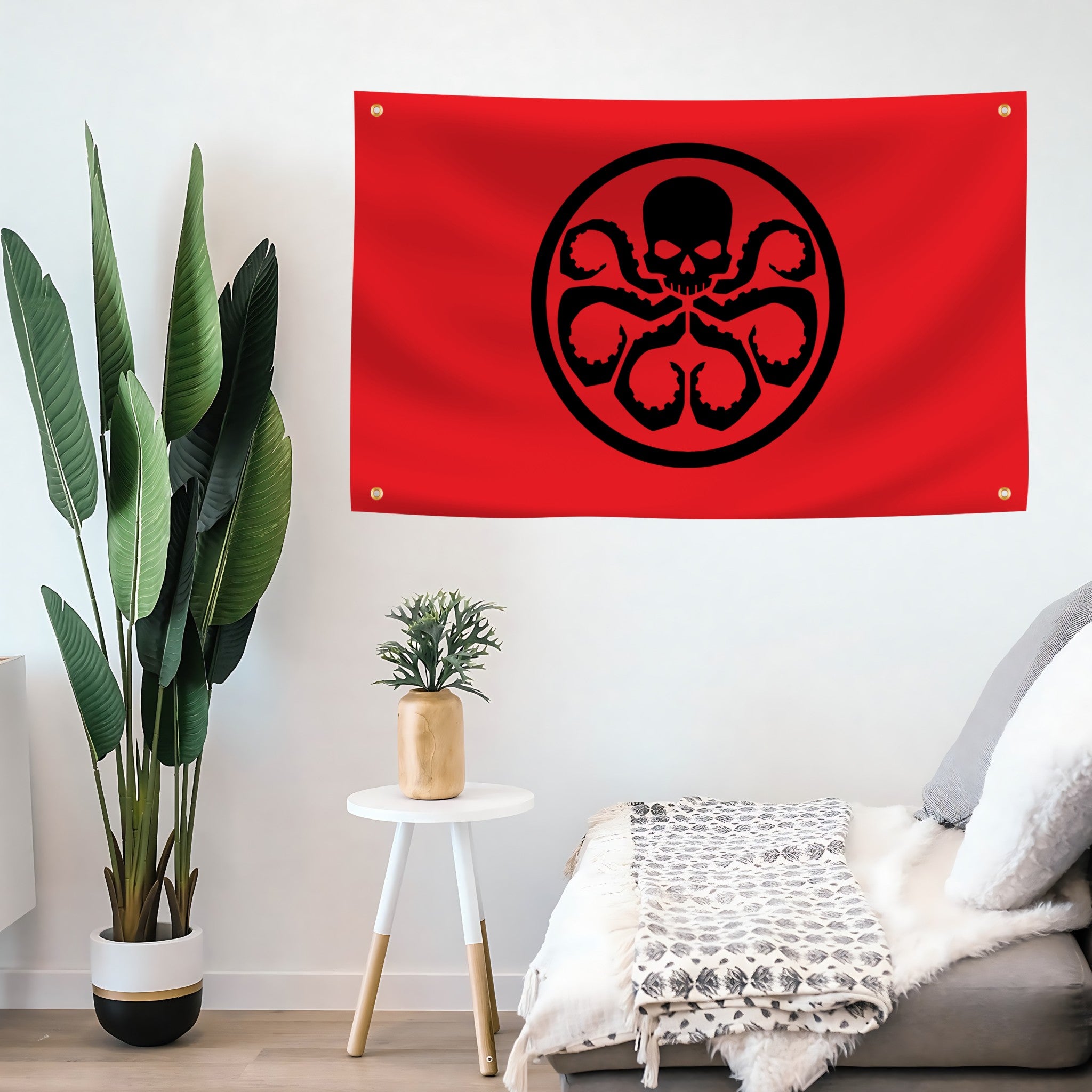 Red flag banner with a black Hail Hydra symbol white wall above a sofa.